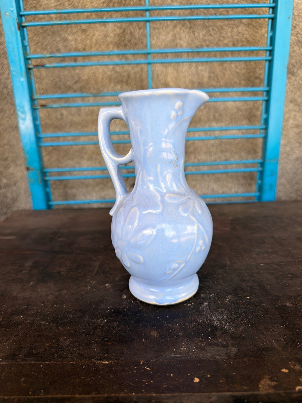 Vintage Light Blue Ceramic Pitcher with Floral Relief Design