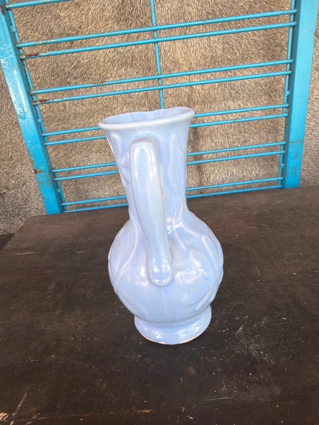 Vintage Light Blue Ceramic Pitcher with Floral Relief Design