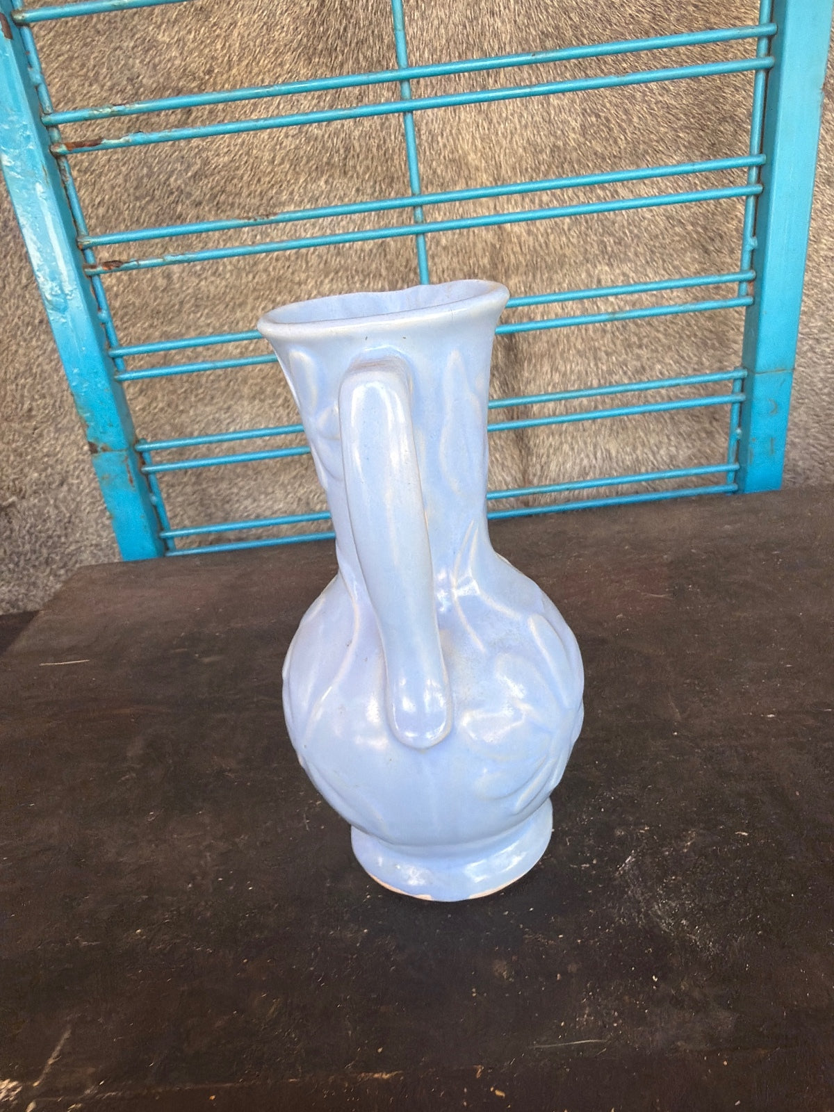 Vintage Light Blue Ceramic Pitcher with Floral Relief Design