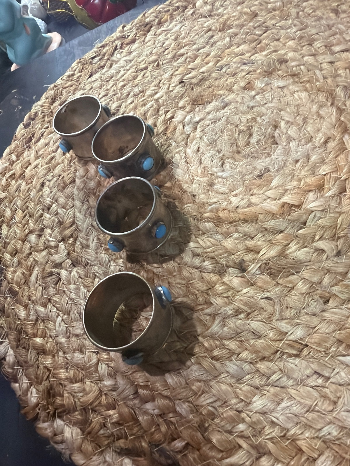 vintage silverplate napkin rings with inset round turquoise cabochon stones.