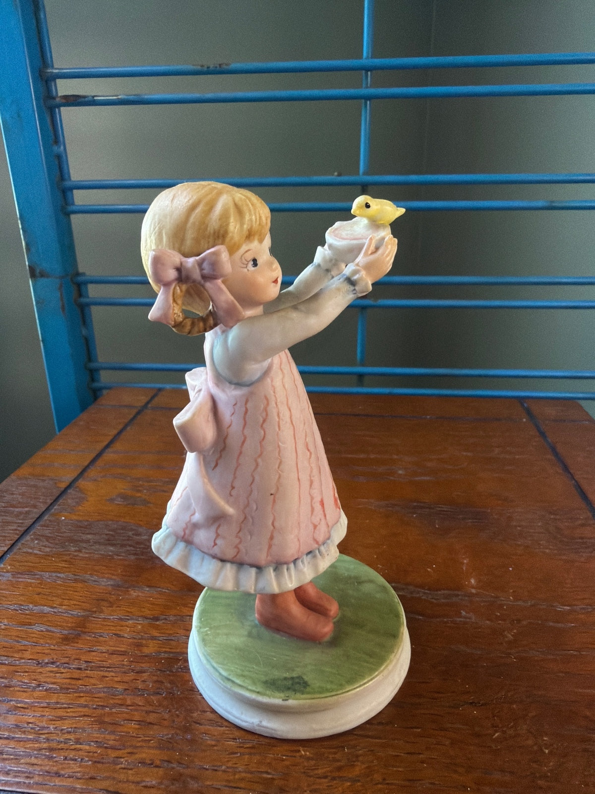 Vintage Ceramic Figurine of Girl Holding a Yellow Bird
