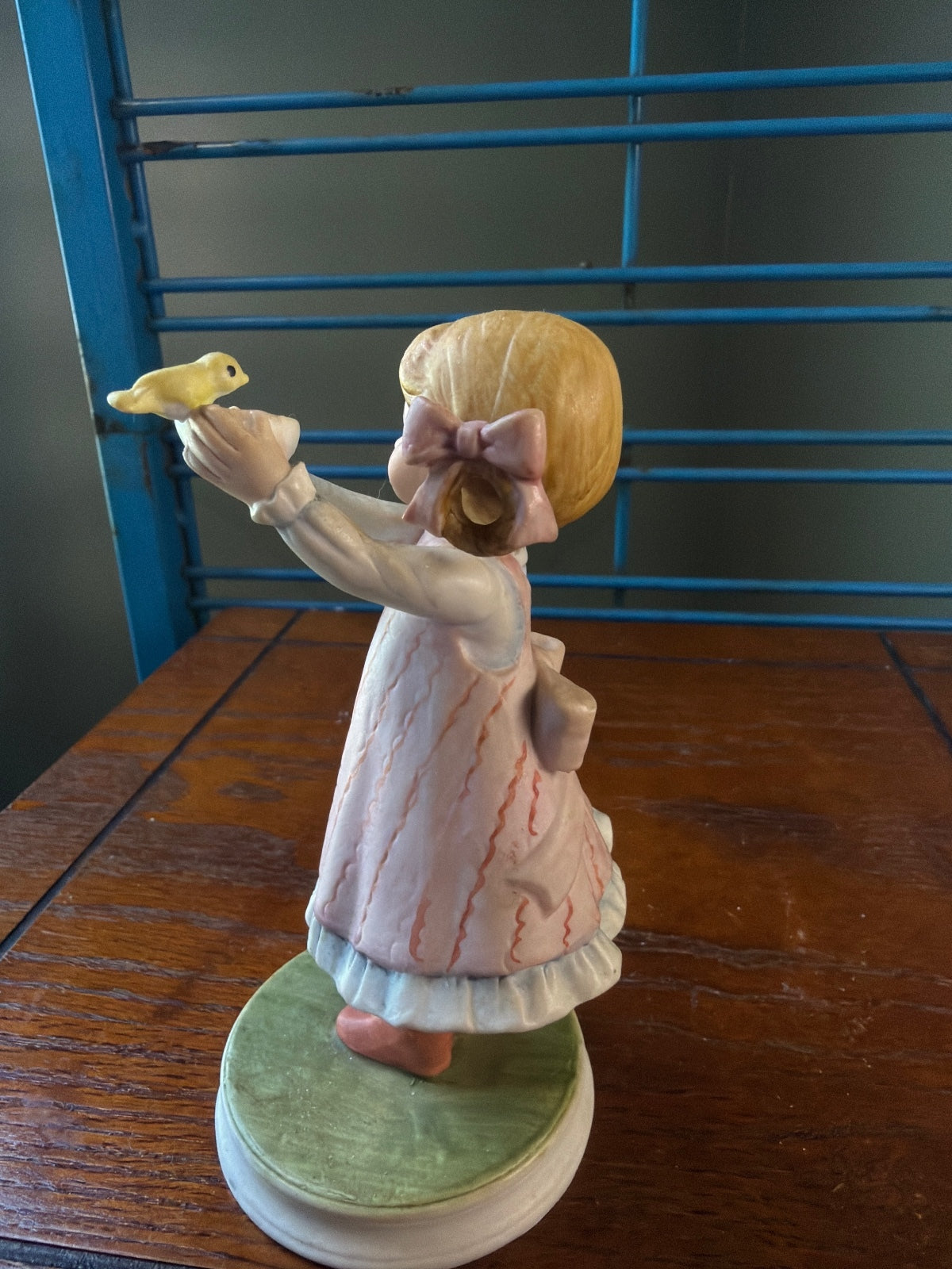 Vintage Ceramic Figurine of Girl Holding a Yellow Bird