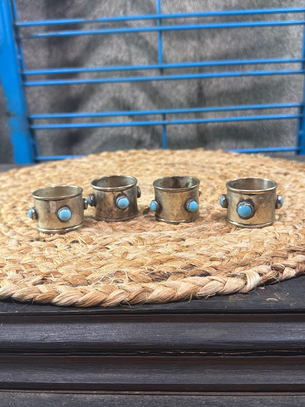 vintage silverplate napkin rings with inset round turquoise cabochon stones.