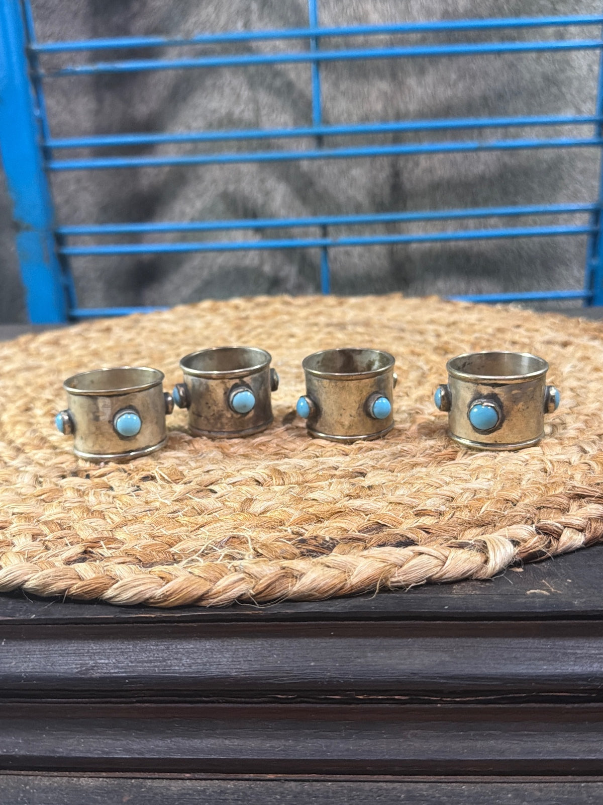 vintage silverplate napkin rings with inset round turquoise cabochon stones.