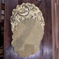 quilted placemats feature a sage green and brown paisley with a scalloped edge.